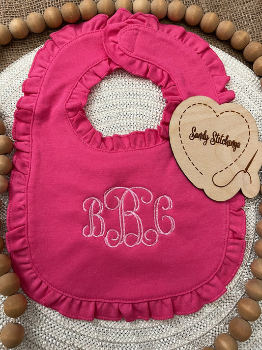 Monogrammed ruffled bib